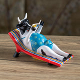 SUNBATHER COW C/12
