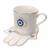 EVIL EYE CUP AND SAUCER WHITE C/36